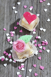 Two petit four and baking decor on grey wood - CSF021131