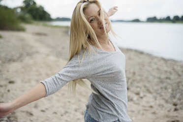 Young woman dancing on beach - LFOF000163