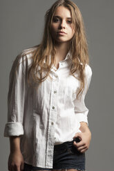 Portrait of female teenager with long brown hair wearing white blouse - LFOF000180