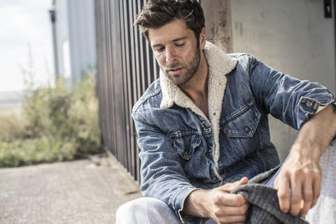 Portrait of man wearing denim jacket stock photo