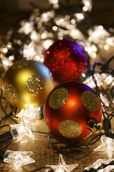 Three Christmas baubles and tangled Christmas lights - HAWF000017