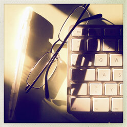 Office desk, keyboard, glasses, pen, Hamburg, Germany - MSF003676