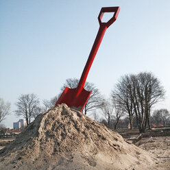 The Netherlands, North Holland, Amsterdam, Big red shovel on a construction site, - HAWF000045