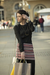 Portrait of young woman with shopping bags - UUF000084