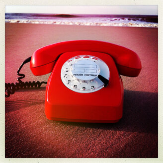 Retro phone at the beach Norderney, Germany - JAWF000021