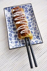 Hashimaki, Japanese savory cabbage pancakes on chopsticks - HAWF000050