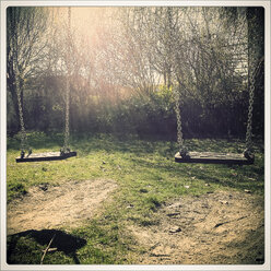 Swings on a playground, Landshut, Bavaria, Germany - SARF000432