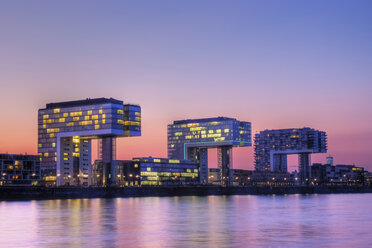 Germany, North Rhine-Westphalia, Cologne, Crane houses at Rheinau harbour by twilight - PA000588