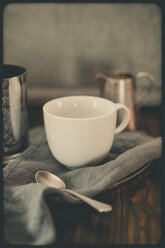 White cup on silver plate with silver tea caddy and milk jar - SBDF000764