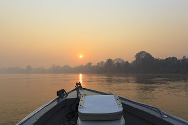 Brazil, Mato Grosso do Sul, Pantanal, Boat on Cuiaba River at sunrise - FOF006459