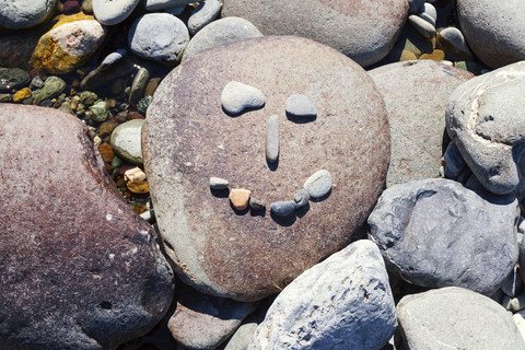 New Zealand, Marlborough Sounds, Pelorus river, smiley made of stones stock photo
