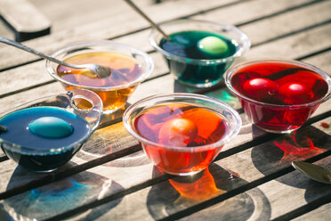 Germany, Bavaria, Colorful Easter eggs in dye - SARF000441