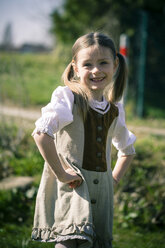 Portait of little girl posing in country style dress - SARF000468