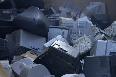 Pile of old computers and television sets at recycling yard - SGF000564