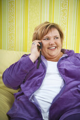 Germany, Mid-adult woman using mobile phone - ECF000581