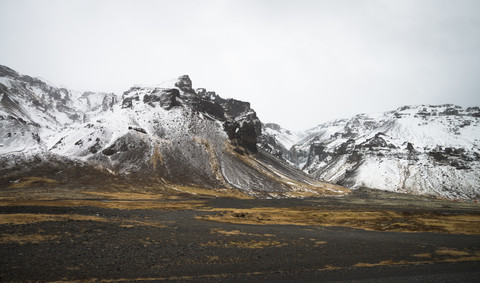 Iceland, Snow on mountains in Pjodvegur stock photo