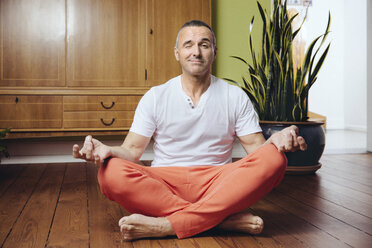 Man Sitting at Lotus Yoga Pose. Home Morning Routine Stock Image - Image of  older, attractive: 191754121