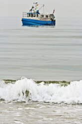 Germany, Baltic Sea, Fishing boat and wave - MELF000001