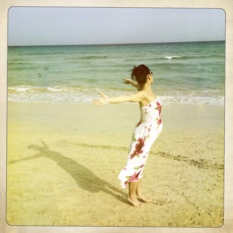 Pregnant woman standing on the Beach, Fuerteventura, Spain stock photo