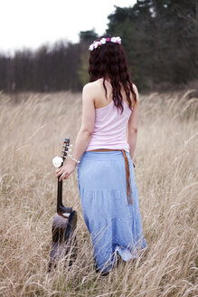 Germany, Young woman with guitar - AFF000053