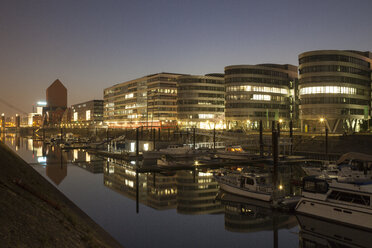 Germany, North Rhine-Westphalia, Duisburg, Inner harbour and office buildings, Five Boats, by night - WIF000609