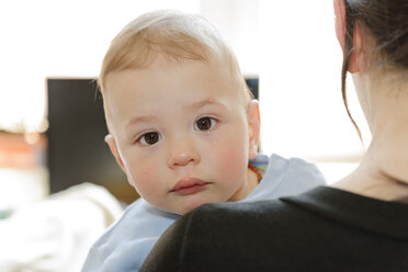 Mother holding crying baby boy - LAF000789