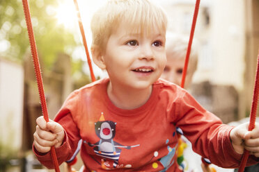 Little boy having fun on a swing - MFF001090