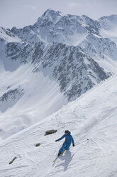 Austria, East Tyrol, Defereggental, Man telemark skiing - FF001406