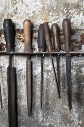 Germany, Bavaria, Josefsthal, fitting with six old metal files at historic blacksmith's shop - TCF003943