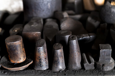 Germany, Bavaria, Josefsthal, old anvil beaks at historic blacksmith's shop - TCF003987