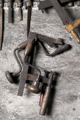 Germany, Bavaria, Josefsthal, wood drill, sew, bar clamp and files at historic blacksmith's shop - TCF003950