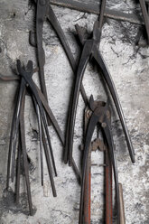 Germany, Bavaria, Josefsthal, grippers at historic blacksmith's shop - TCF003954