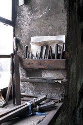 Germany, Bavaria, Josefsthal, tools on window sill at historic blacksmith's shop - TCF003978