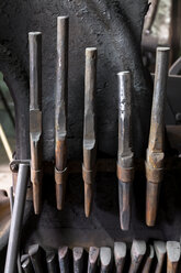 Germany, Bavaria, Josefsthal, drift punches at historic blacksmith's shop - TCF003982