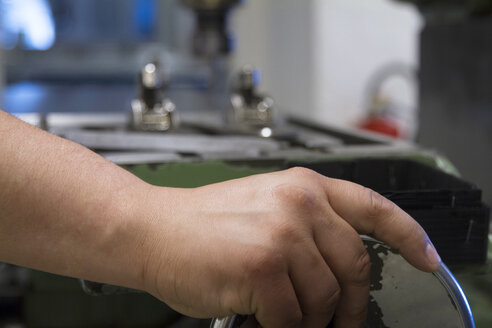 Germany, Freiburg, Female technician working in a metalworking workshop - SGF000595