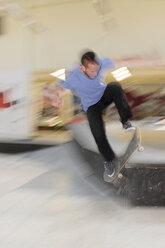 Skate boarder making Wallie at skateboard ground - LAF000740