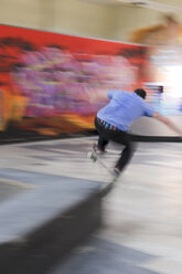 Skate boarder making Wallie at skateboard ground - LAF000744