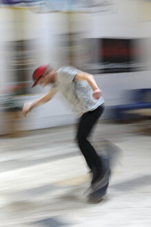 Skate boarder making Ollie at skateboard ground - LAF000745