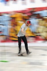 Skate boarder making Ollie at skateboard ground - LAF000746