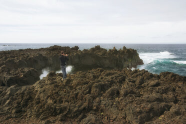 Portugal, Azores,Sao Miguel, Tourist capturing view - ONF000480