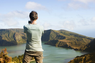 Portugal, Azores,Sao Miguel, Tourist capturing view - ONF000481