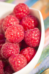 Bowl of raspberries, partial view - SARF000541