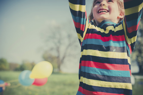 Happy little boy with outstretched arms, partial view stock photo