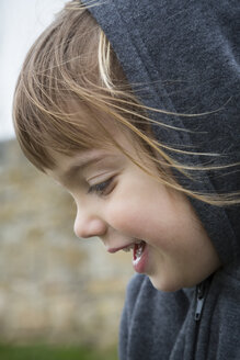 Portrait of laughing little girl wearing hooded jacket - LVF001153