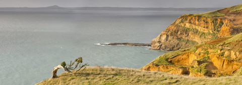 Neuseeland, Chatham-Insel, Rote Klippen bei Point Weeding, lizenzfreies Stockfoto