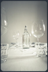 Laid table in white with glasses and water bottle - SBDF000818