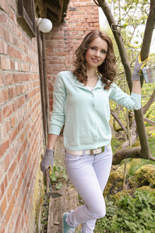 Portrait of woman with gardening gloves - VTF000221