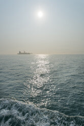 China, Hong Kong, container ship in the back light on the way to Lamma Island - SHF001269