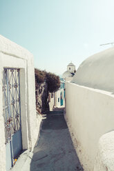 Greece, Cyclades, Santorini, Thera, alley with church in the background - KRPF000533