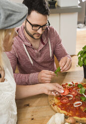 Couple cooking in kitchen at home - UUF000521